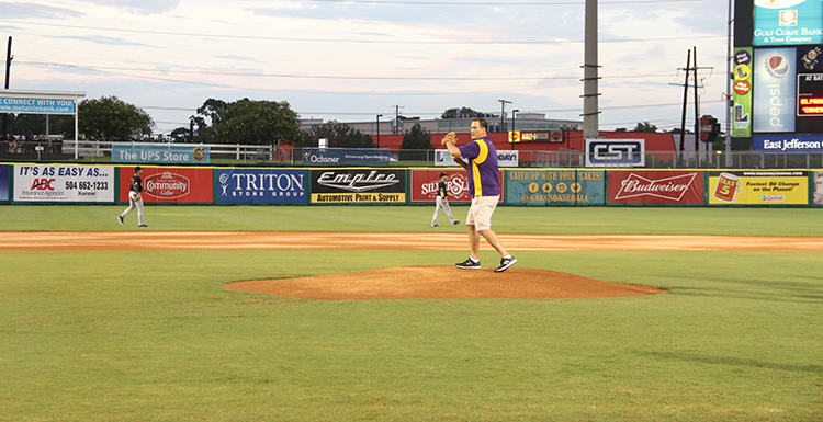 LSUHealthNO's Carl Kluttz throws first pitch